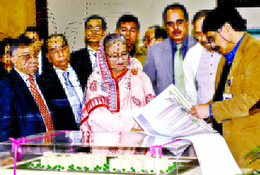 Prime Minister Sheikh Hasina sees the model of residential area for officials and employees of Rooppur Nuclear Power Project at her office on Wednesday.BSS photo