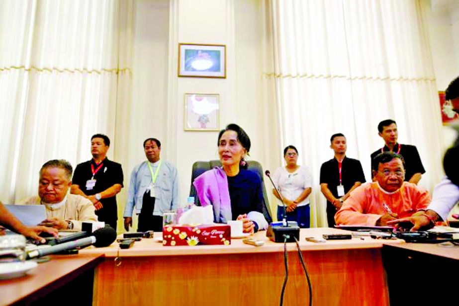 Myanmar's National League for Democracy leader Aung San Suu Kyi talks to journalists during her meeting with the media in her office at the parliament in Naypyitaw on Wednesday.