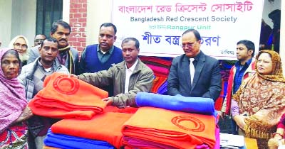 RANGPUR: Dr ATM Mahbubul Karim, ADC (Gen ) and General Secretary of District Awami League Adv Rezaul Karim Raju distributing blankets donated by Bangladesh Red Crescent Society among cold -hit people on Tuesday.