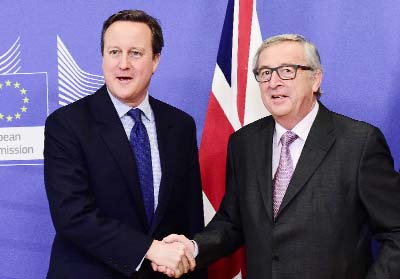 British Prime Minister David Cameron (L) is welcomed by European Commission President Jean-Claude Juncker prior to a meeting at the European Commission in Brussels