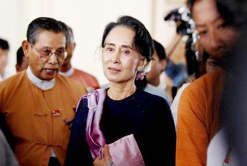 Myanmar's National League for Democracy leader Aung San Suu Kyi leaves after she attended as an observer for opening of the new upper house of parliament in Naypyitaw.