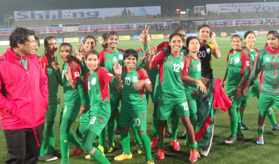 Members of Bangladesh National Women's Football team celebrating after beating Sri Lanka National Women's Football team by 2-1 goals in the Football Competition of the 12th SA Games at Shillong in India on Sunday.