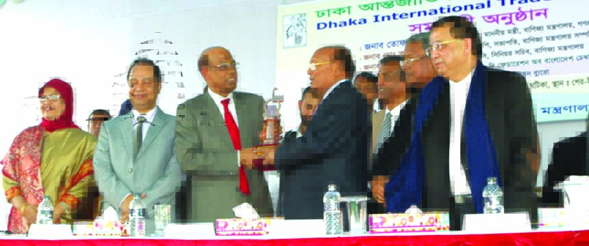 KM Akhtaruzzaman, Director of FBCCI and Managing Director of Akhter Furnishers, receiving 3rd prizes on premium pavilion category from commerce minister Tofail Ahmed at the closing ceremony of Dhaka International Trade Fair 2016 recently. FBCCI President