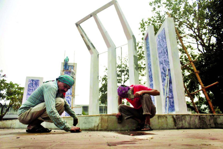 Workers cleansing the Central Shahid Minar prior to Ekushey celebration on February 21 marking the Language Martyrs of 1952 Language Movement.