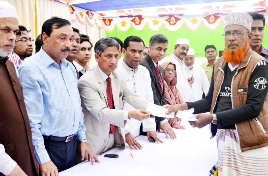 Chairman of Chittagong Development Authority (CDA) Abdus Salam distributing cheque among the affected people of outer ring road recently.