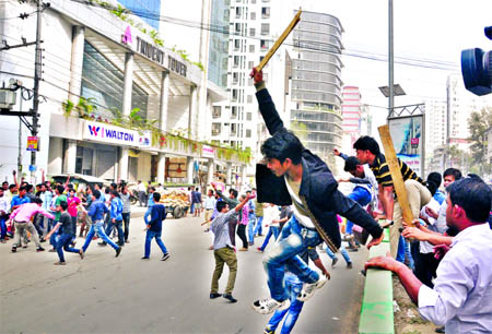 Members of new JCD committee chasing the deprived activists equipped with sticks while they were attacking BNP's central office at Naya Paltan again on Wednesday.