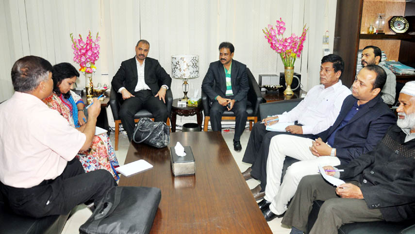 CCC Mayor A J M Nasir Uddin speaking at a meeting with environment specialists of City Governance Project at his office on Wednesday.