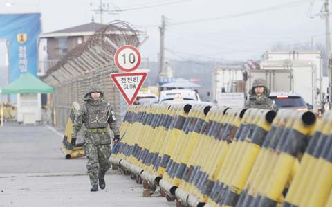 South Korean amy soldiers walk on Unification Bridge, which leads to the demilitarized zone, near the border village of Panmunjom in Paju, South Korea on Thursday.