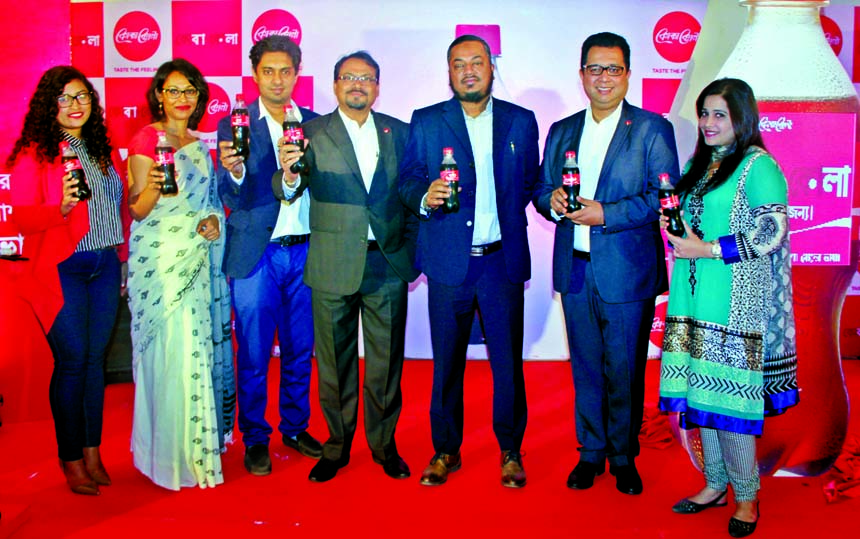 Shadab Ahmed Khan, Managing Director, Coca-Cola Bangladesh Limited, Tapas Kumar Mondal, Managing Director, International Beverages Private Limited, Gazi M Shamsuddin, Chief Operating Officer, Abdul Monem Ltd pose at the launching campaign of 'joy and lov