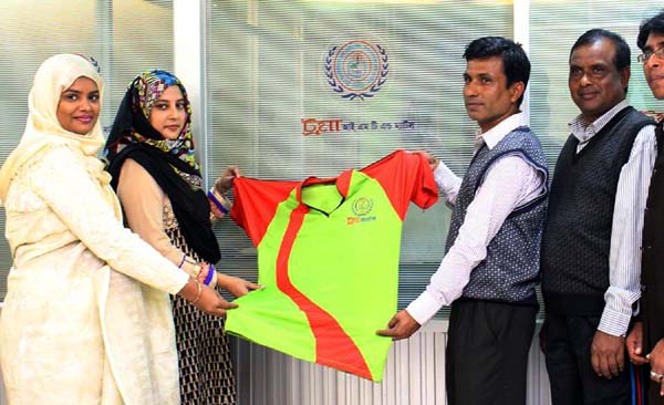Director of Trauma Mats Tanjina Khan and Principal of Trama Mats Dr Ibrahana Islam handing over the jersey to the representative of Sathia Model Government Primary School Football team of Pabna, at the Trauma IMT & Mats Bhaban in the city's Shewrapara on