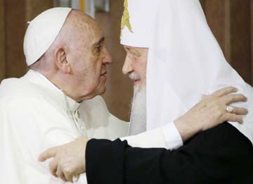 Pope Francis, left, embraces Russian Orthodox Patriarch Kirill after signing a joint declaration on religious unity at the Jose Marti International airport in Havana, Cuba, on Friday.