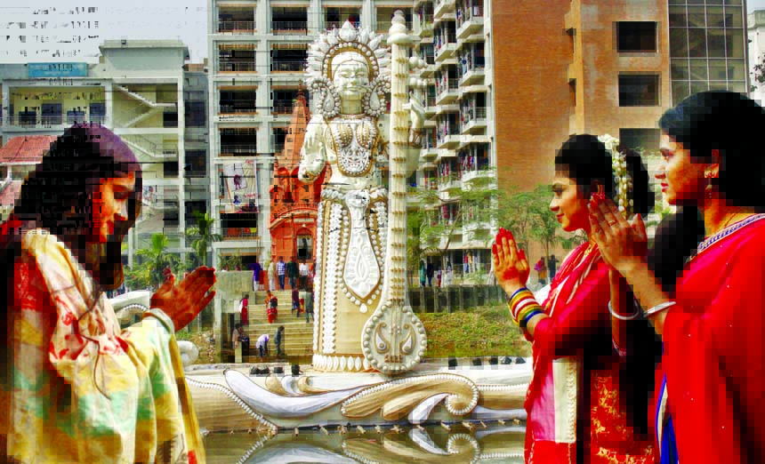 Students offering prayers to seek blessings from Saraswati, Goddess of learning and wisdom on the occasion of Saraswati Puja at Jagannath Hall premises of Dhaka University on Saturday.