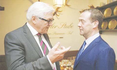 German Foreign Minister Frank- Walter speaks to Russian Prime Minister Dmitry Medvedev durig a meeting on the sideline of Munich Security Conference on Saturday.