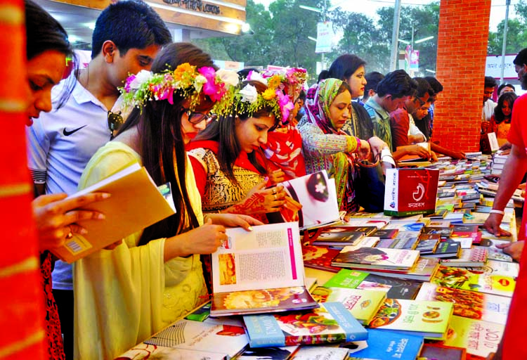 Kids with their parents engaged in choosing books at Ekushey Boi Mela on the occasion of Valentine's Day on Sunday.