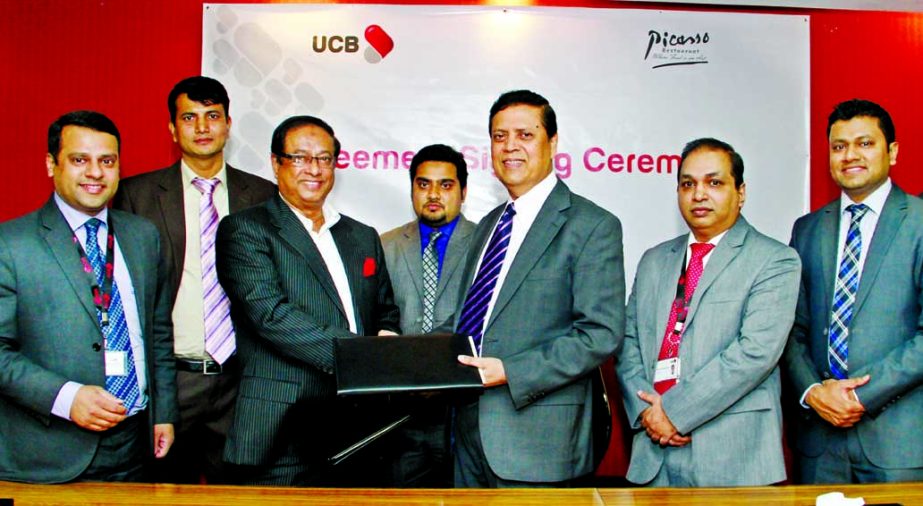 Muhammed Ali, Managing Director of United Commercial Bank Limited and Lt.Gen Masud Uddin Chowdhury, ndc, psc (Retd), Managing Partner of Picasso Restaurant signing agreement on which UCB Cardholders and Imperial Customers of UCB will enjoy 15% Discount an