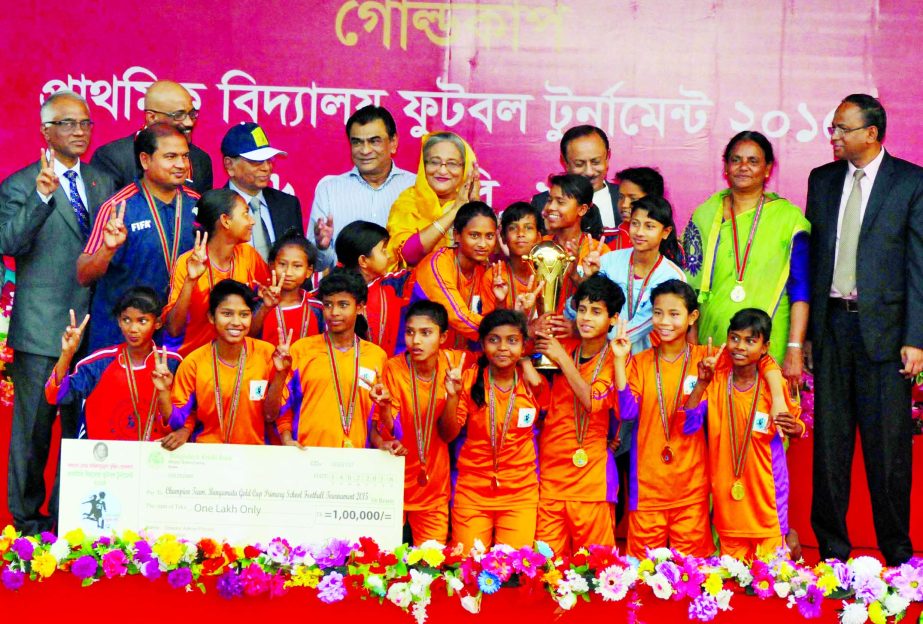 Kolsindur Primary School of Dhobaura Upazila of Mymensingh District, the champions of the Bangmata Sheikh Fazilatunnesa Mujib Primary School Gold Cup Football Tournament with the chief guest Prime Minister Sheikh Hasina pose for a photo session at the Ban