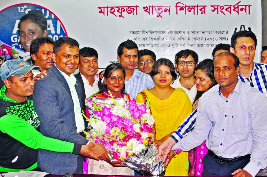 Chittagong University Journalism Association, Dhaka greets Mahfuza Khatun Shila, a student of Communication and Journalism Department of Chittagong University by giving bouquet at the Jatiya Press Club on Tuesday for achieving two gold medals for Banglade