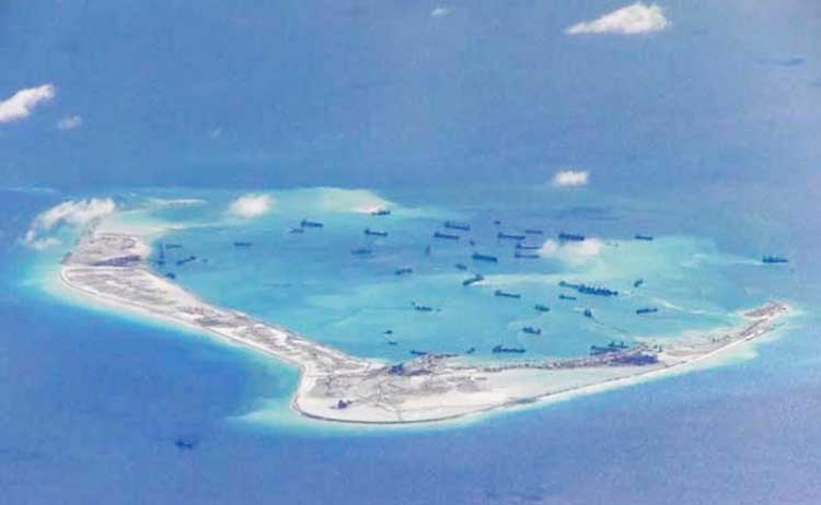China has been asserting its presence in the disputed waters by building artificial islands.