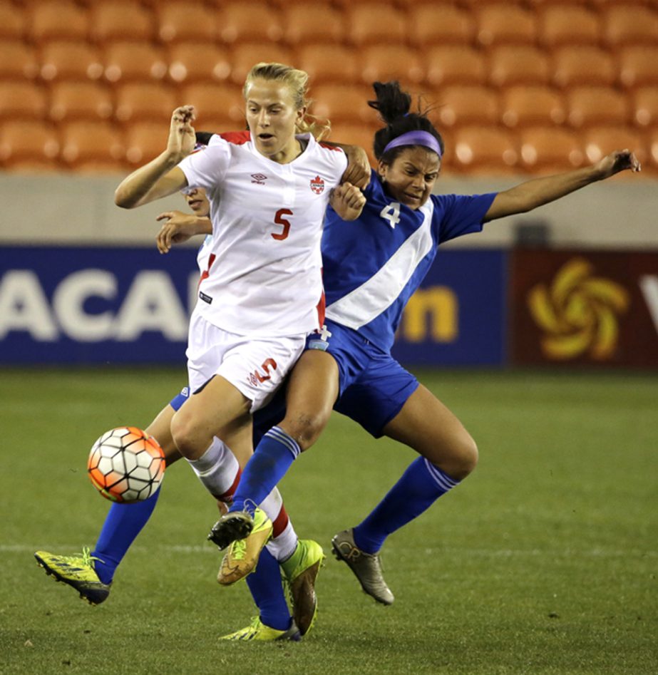 Guatemalaâ€™s Christian Recinos (4) challenges Canada's Rebecca Quinn (5) for the ball during the first half of a CONCACAF Olympic qualifying tournament soccer match in Houston on Tuesday.