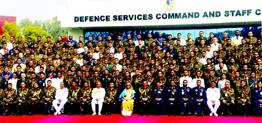 Prime Minister Sheikh Hasina poses for photograph with graduates of Defence Services Command and Staff College, 2015-'16 batch at Mirpur Cantonment in the city on Thursday.