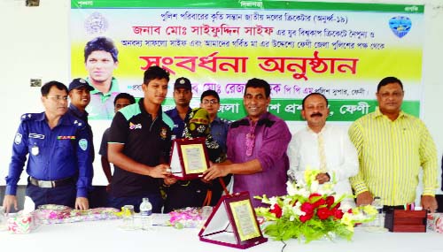 FENI: Feni Police Super Md. Rezaul Haq PPM presenting crest to all-rounder Saif of U-19 Cricket World Cup at a reception accorded to him in Feni recently.