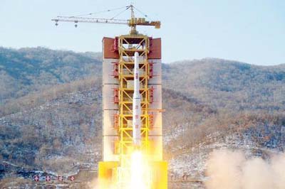 A North Korean long-range rocket is launched into the air at the Sohae rocket launch site, North Korea, in this photo released by Kyodo.