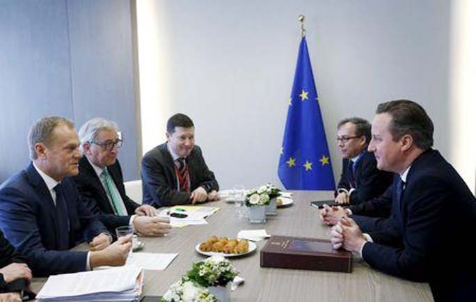 European Council President Donald Tusk, left, and European Commission President Jean-Claude Juncker, second left, participate in a meeting with British Prime Minister David Cameron during an EU summit in Brussels on Friday.