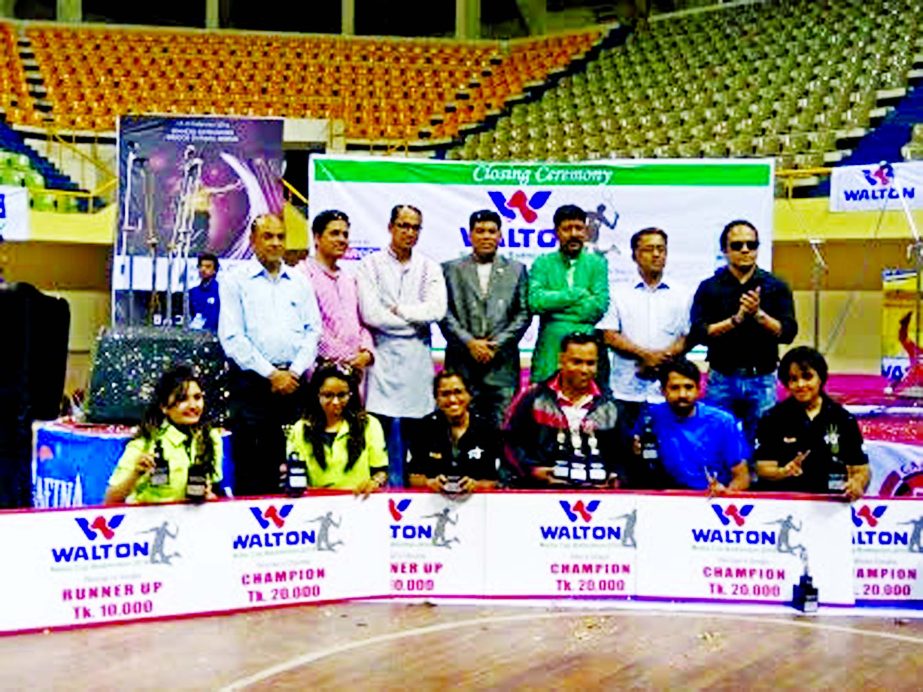 The winners of the Media Cup Badminton Tournament with the chief guest FM Iqbal Bin Anwar Dawn, the Senior Additional Director of Walton and officials of Bangladesh Sports Press Association pose for a photo session at the Shaheed Suhrawardy Indoor Stadium