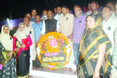 GOURIPUR(Mymensingh): Sayed Rafiqual Islam, Mayor, Gouripur Pourashava with other officials placing wreaths the Shaheed Minar marking the International Mother Language Day on Sunday.