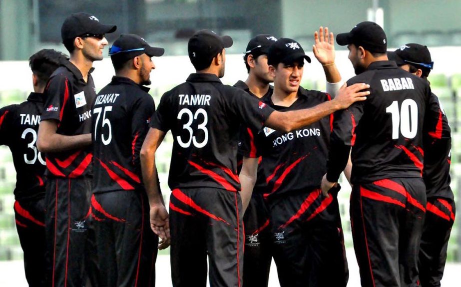 Players of Hong Kong Cricket team celebrate after taking a wicket of Afghanistan in their last qualifying round match at Sher-e-Bangla National Cricket Stadium in Mirpur on Monday.