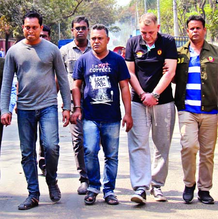 A foreigner, identified as Piotr Szczepan Mazurek carrying fake police passport was arrested in city along with two bank employees (seen) on Monday allegedly in connection with recent cases of ATM fraud in Bangladesh.