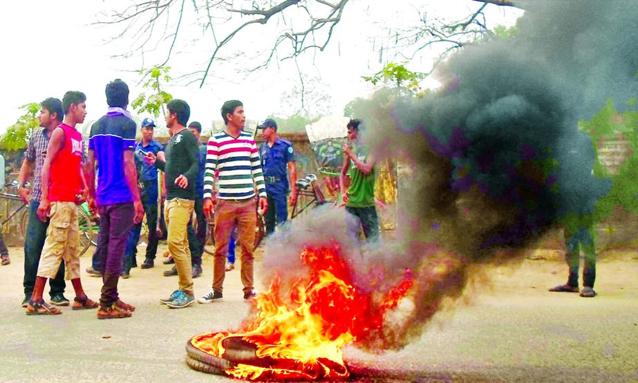 A day-long road blockade at Khagrachhari was observed with setting fire and picketing on Monday protesting punishment to killers of a motorbiker and kidnapper of two youths recently.