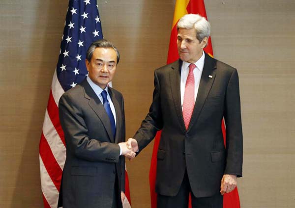 US Secretary of State John Kerry, right, shaking hands with China's Froreign, Minister Wang Yi, during a meeting in Munich, Germany.