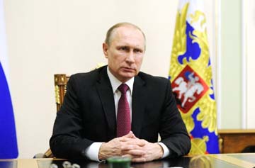 Russian President Vladimir Putin delivers an address on the US and Russia's agreement to enforce ceasefire in Syria in his office near Moscow on Monday.