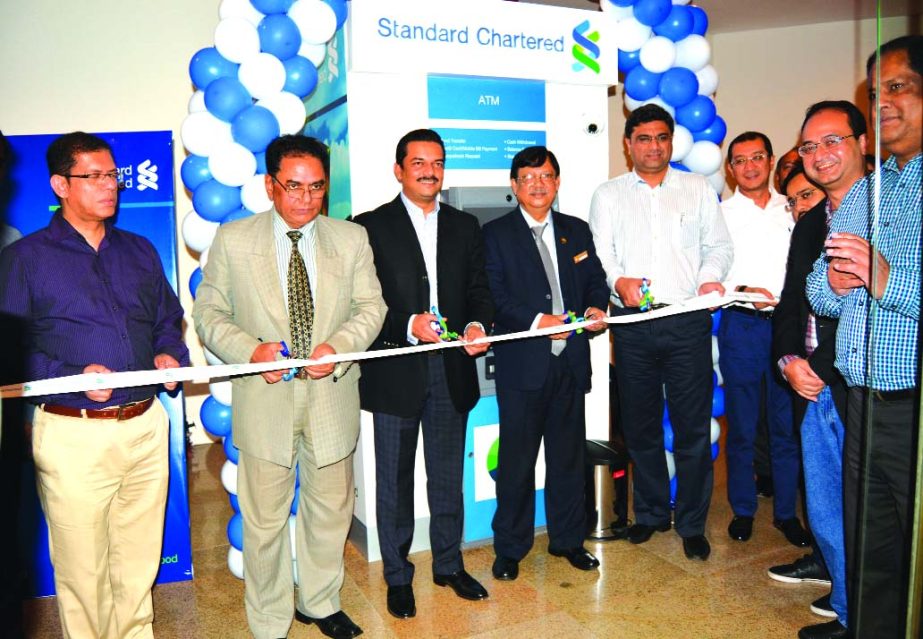Abrar A Anwar, CEO; Aditya Mandloi, Head of Retail Banking, Standard Chartered Bank, Bangladesh and Md Hayat Khan, Finance Controller, Ocean Paradise Hotel & Resort along with other senior officials of both organizations, inaugurating the new ATM at the h