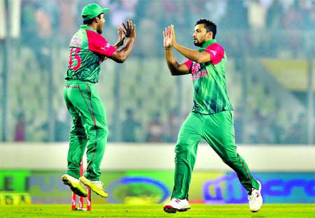 Mashrafe Mortaza celebrates with team mate after taking the big wicket of Virat Kohli during the Asia Cup 2016 cricket match between Bangladesh and India at the Sher-e-Bangla National Cricket Stadium on Wednesday.