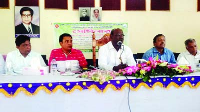 BHANGOORA (Pabna): Maqbul Hussain MP, Chairman of the Parliamentary Standing Committee on the Ministry of Agriculture speaking at a seminar on modern techniques to increase crop production on Monday.