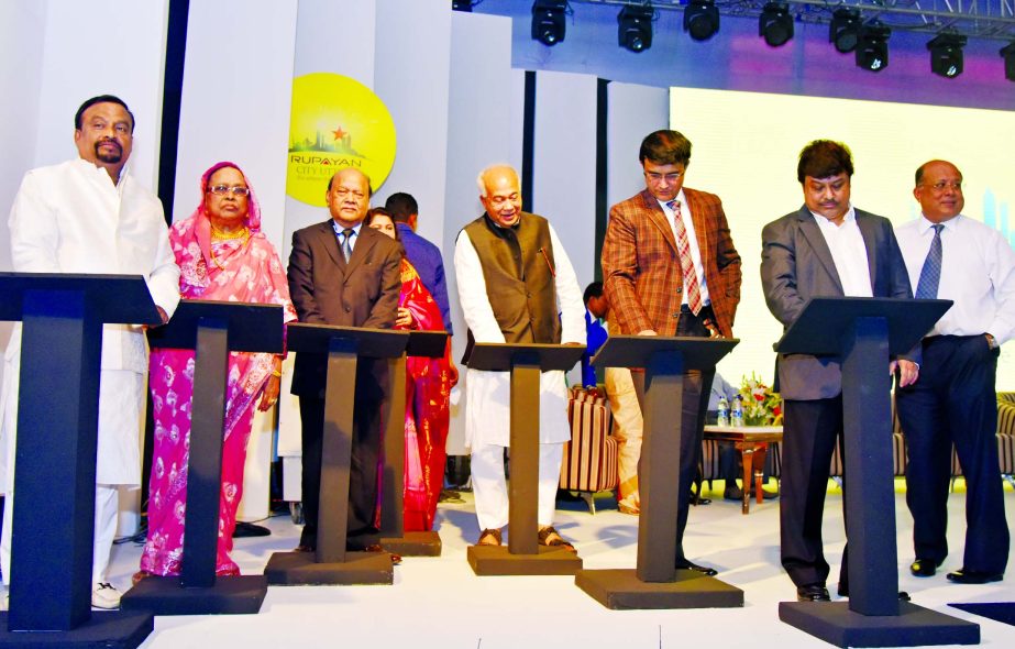 Sourav Ganguly, the Indian cricketing legend and the brand ambassador of Rupayun Group poses at the inaugural ceremony of Rupayan City Uttara in the city on Thursday. Mosharaf Hossain Minister of Housing and Public Works, L.A. Mukul, Chairman of Rupayan G