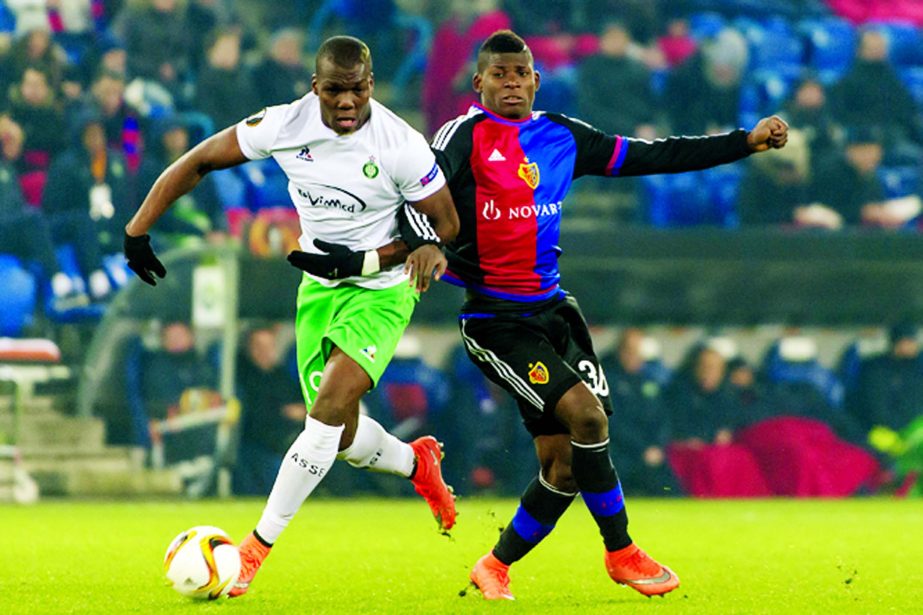 Saint-Etienne's Florentin Pogba (left) fights for the ball against Basel's Breel Embolo during the Europa League, Round of 32, second leg soccer match between FC Basel 1893 and AS Saint-Etienne at the St. Jakob-Park stadium in Basel, Switzerland on Thur