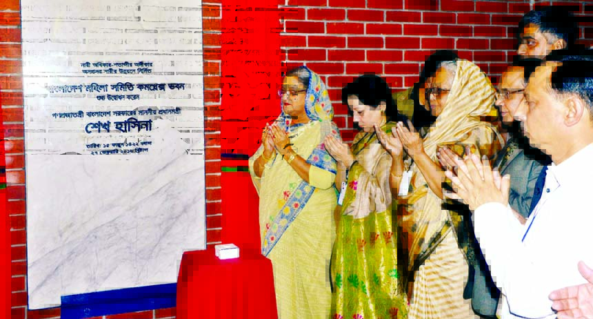 Prime Minister Sheikh Hasina along with others offering munajat after inaugurating the newly constructed building of Bangladesh Mahila Samity in the city's Bailey Road on Saturday. BSS photo