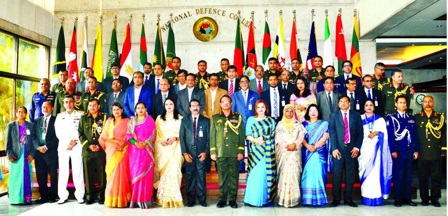 Lt General Chowdhury Hasan Sarwardi, BB, SBP seen with the participants of Capstone Course-16 of NDC, invited guests and staff of the college after inaugurating the course yesterday. ISPR photo