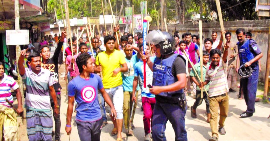 Local Sramik League activists staged demonstration with lethal weapons and bamboo sticks against Narail-2 Constituency lawmaker Sheikh Hafizur Rahman on Sunday. Police trying to keep them caution not to involve in any untoward incident.