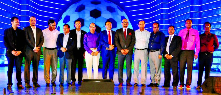 The guests and the officials of Bangladesh Football Federation pose for a photo session after the logo unveiling programme of the Bangladesh Super League at the Bangabandhu National Stadium on Sunday.
