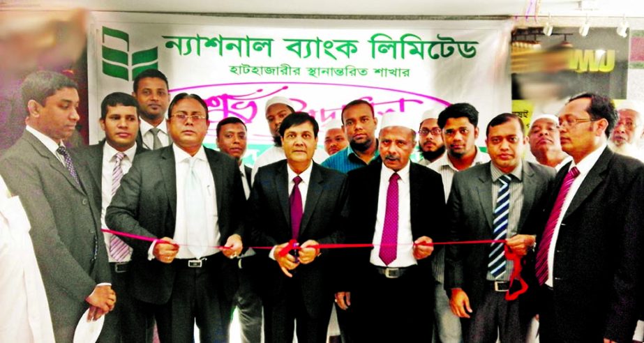 Wasif Ali Khan, Deputy Managing Director & head of Chittagong region of National Bank Limited inaugurating the shifted Hathazari branch by cutting ribbon at Foyez Shopping Center, Ramgor Road, Hathazari' recently. Md Mamnur Rashid Molla, Manager of Khatu