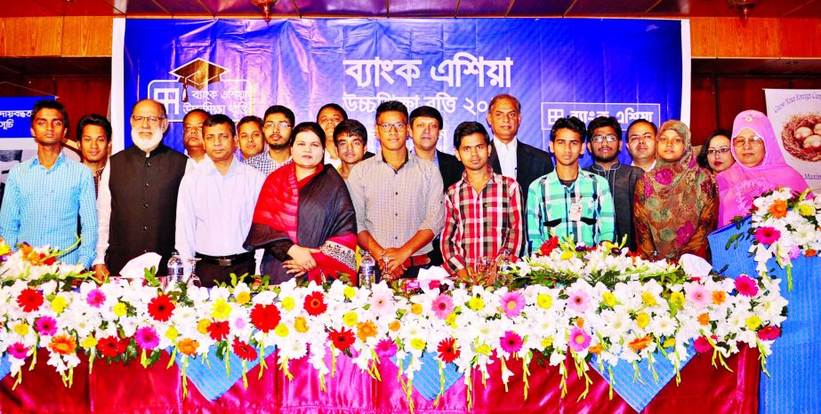 Humaira Azam, Deputy Managing Director of Bank Asia poses with the recipients of Bank Asia Higher Studies Scholarship from Savar, Tongi, Konabari and Hemayetpur of Gazipur district.