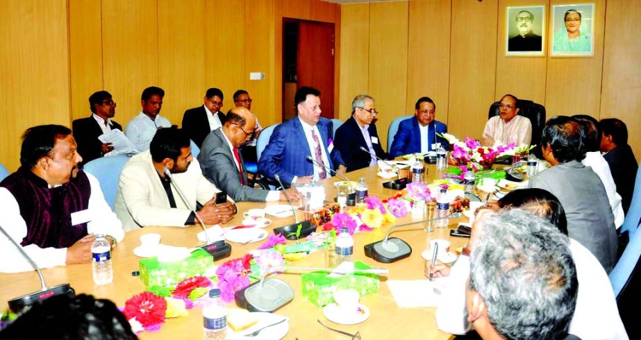 Bangladesh Bank Governor Dr. Atiur Rahman speaking with the leaders of FBCCI at the headquarter of the central bank in the city on Thursday. President of FBCCI Abdul Matlub Ahmad, First Vice-President Md. Shafiul Islam were present on the occasion.