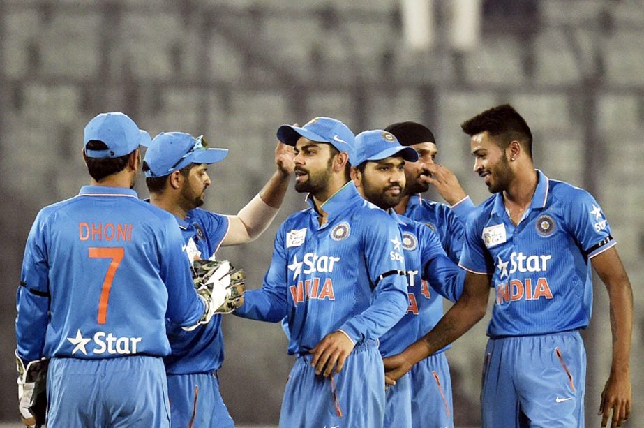 Indian cricketer Virat Kohli (3L) celebrates with teammates after the dismissal of unseen United Arab Emirates batsman Rohan Mustafa during the Asia Cup T20 cricket tournament match between United Arab Emirates and India at The Sher-e-Bangla National Cric