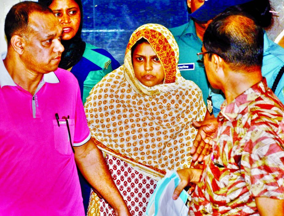 Mother of two Banasree Siblings Mahfuza Malek Jesmin being taken to the court and granted five-day remand on Friday.