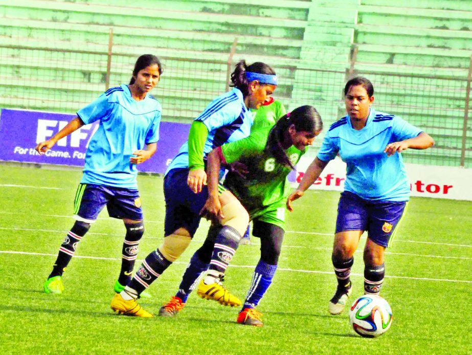 An action from the match of the KFC National Women's Football Championship between BJMC and Rajbari District team at the Bir Shreshtha Shaheed Sepoy Mohammad Mostafa Kamal Stadium in Kamalapur on Friday.