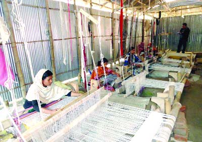 RANGPUR: Women workers of Teesta Char areas are passing busy time in making mats (paposh). This picture was taken on Friday.